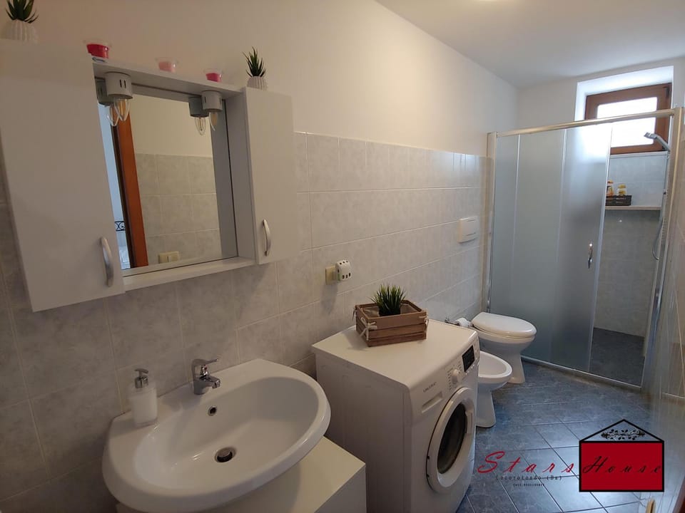 Shower, Toilet, Bathroom, bidet, towels, washing machine