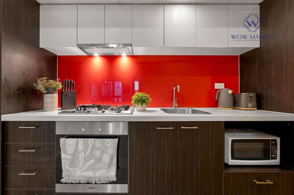Kitchen or kitchenette, dishwasher, oven, stove
