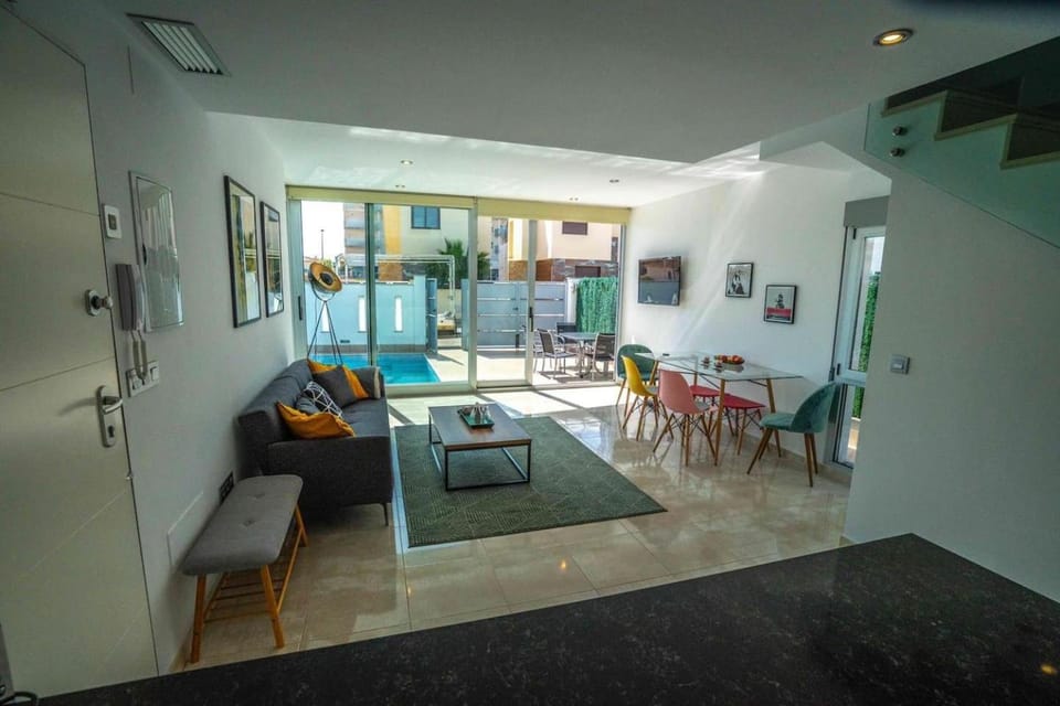 Living room, Seating area, Dining area, Pool view