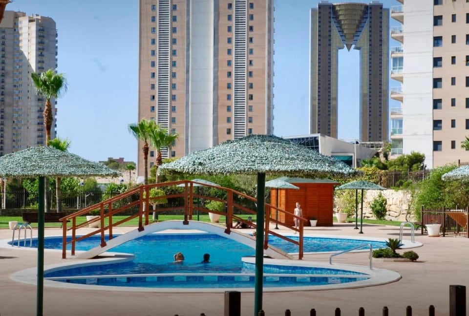 Property building, Day, Natural landscape, Children play ground, City view, Pool view, Swimming pool