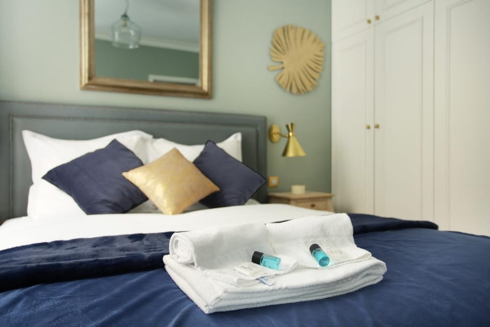 Bed, towels, wardrobe
