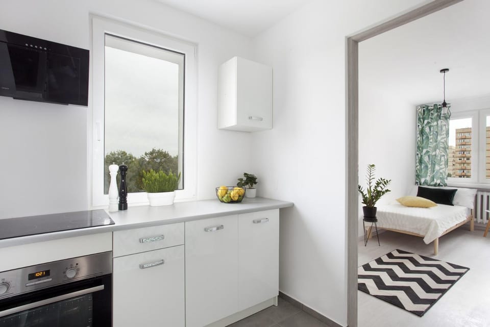 Kitchen or kitchenette, microwave, oven, stove, washing machine