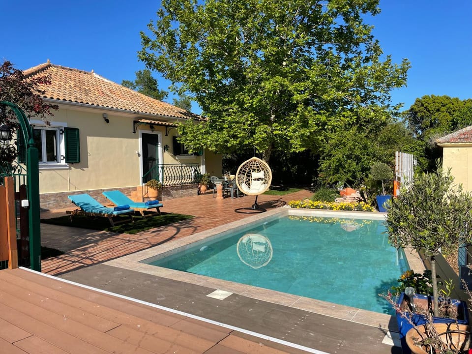 Property building, Day, Natural landscape, Pool view, Swimming pool, sunbed