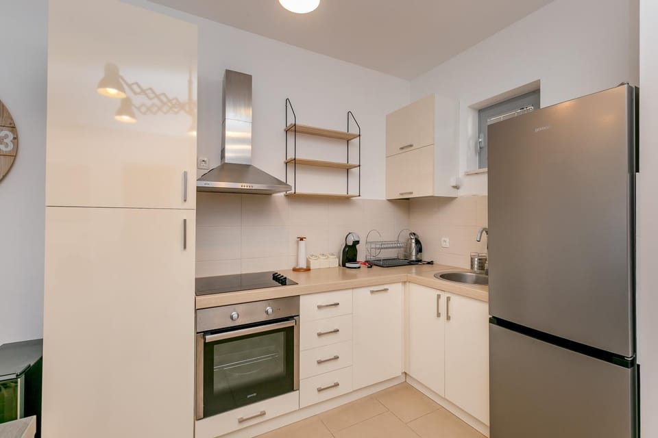 Kitchen or kitchenette, dishwasher, oven, stove, toaster