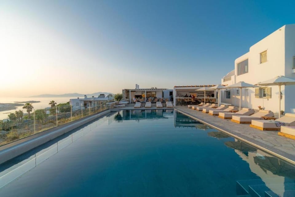 Property building, Day, Natural landscape, Pool view, Swimming pool, sunbed