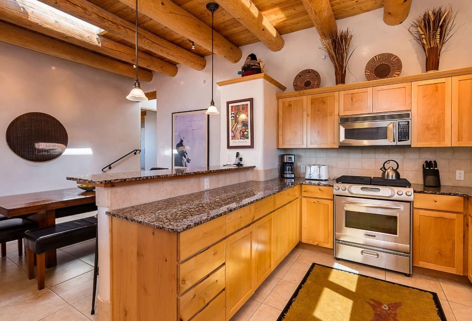 Kitchen or kitchenette, Dining area, furniture, microwave, oven, stove, toaster