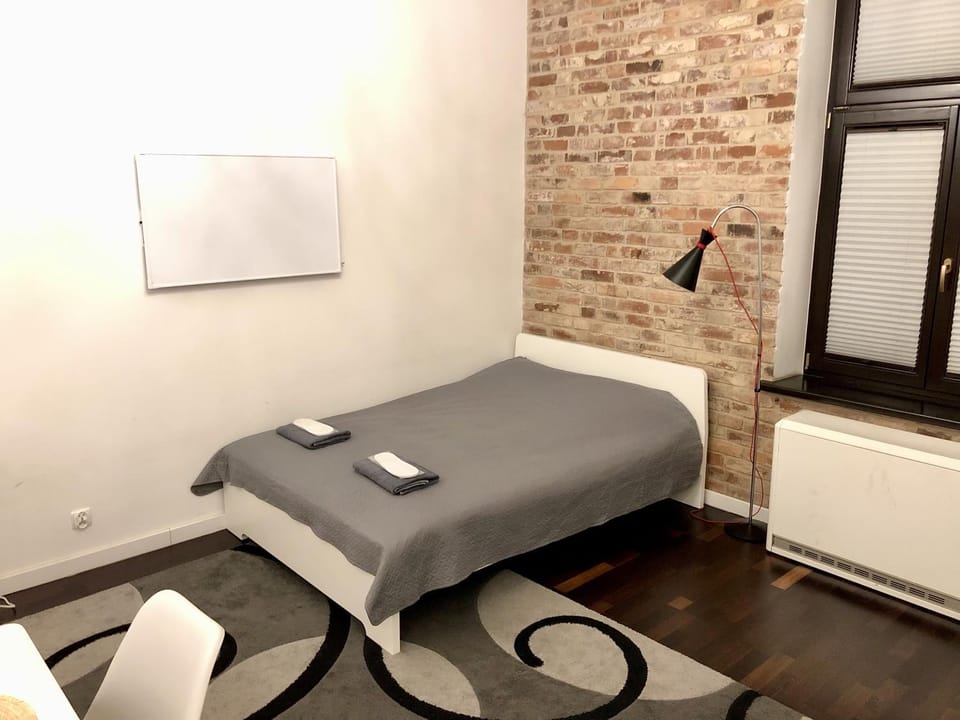 Bed, Living room, Seating area, Bedroom
