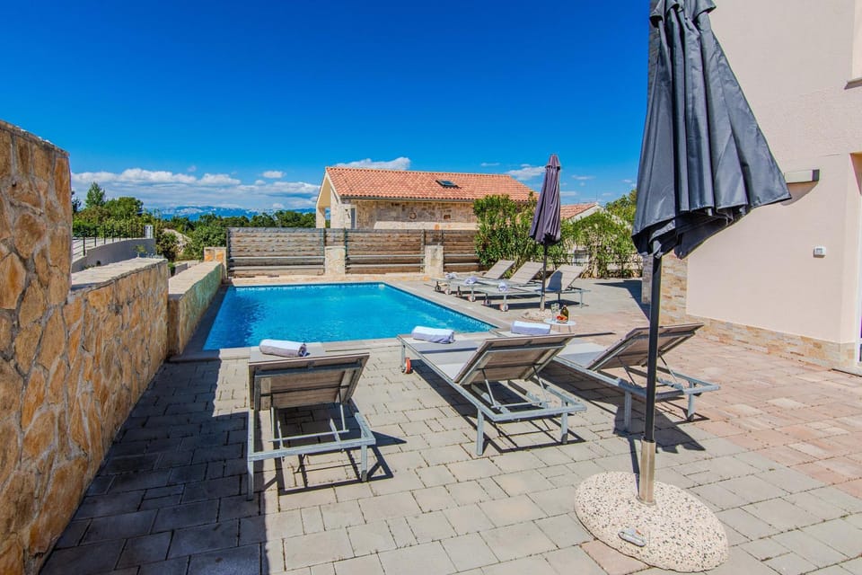 Patio, Day, Natural landscape, Pool view, Swimming pool, sunbed
