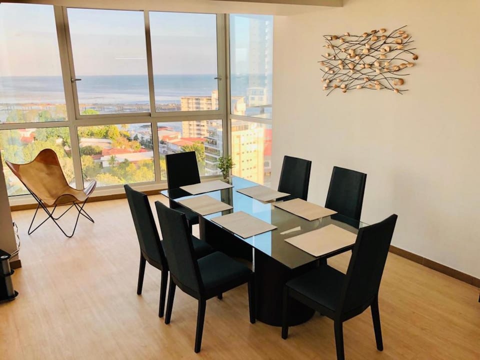 View (from property/room), Living room, Seating area, Dining area, Sea view