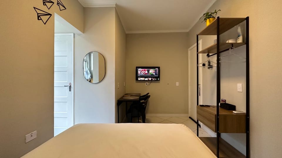 Studio com ar e garagem - Praia das Pitangueiras Apartment in State of São Paulo