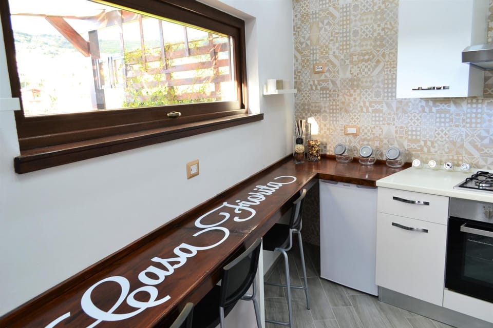 Kitchen or kitchenette, dishwasher, oven, stove