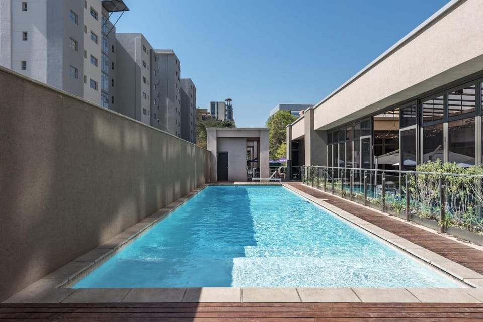 Property building, Pool view, Swimming pool, sunbed