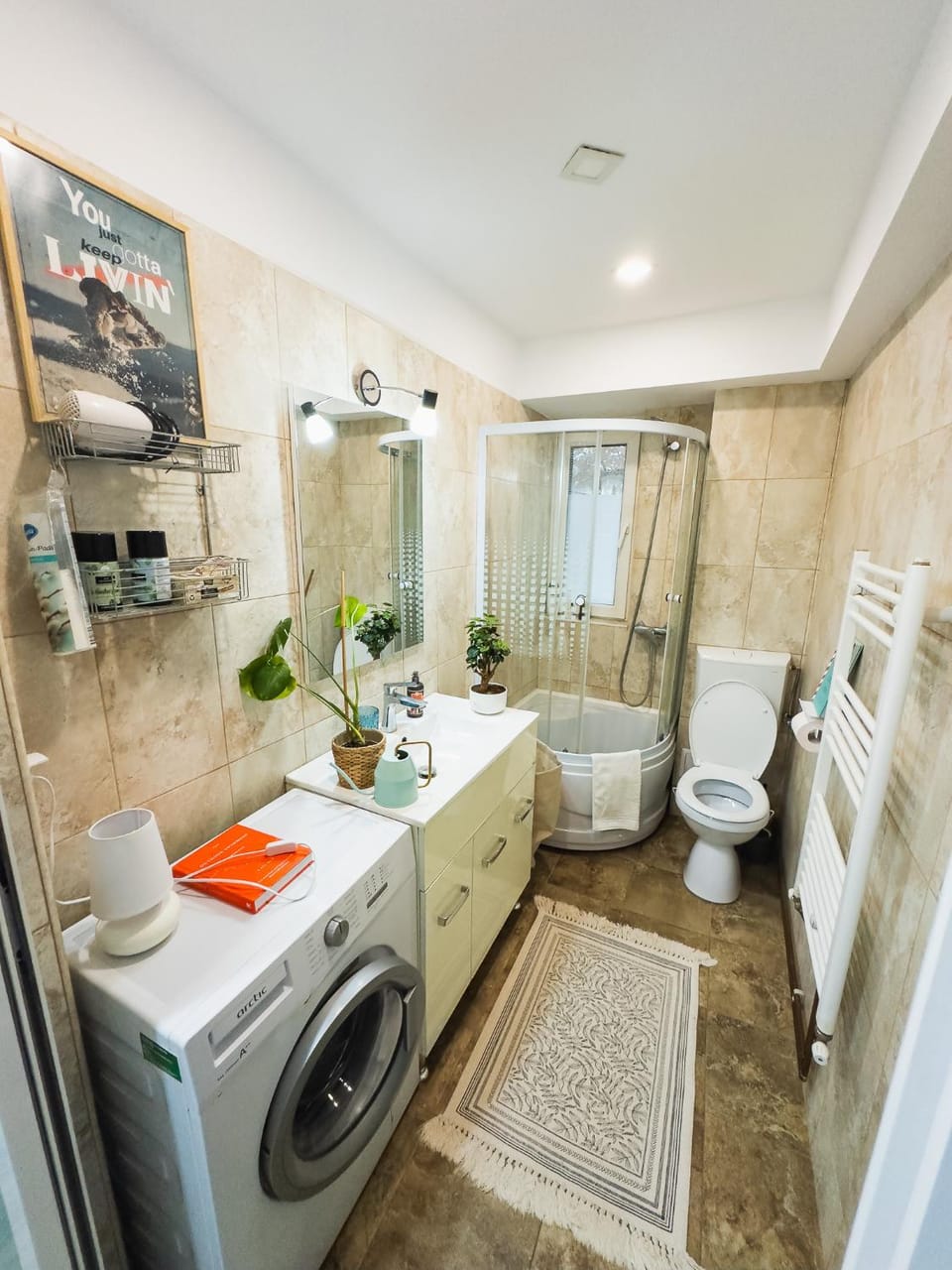 Shower, Toilet, Bathroom, hair dryier, towels, washing machine
