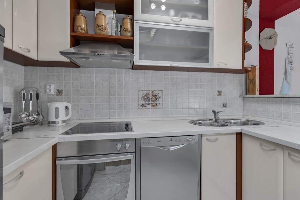 Kitchen or kitchenette, dishwasher, stove, toaster