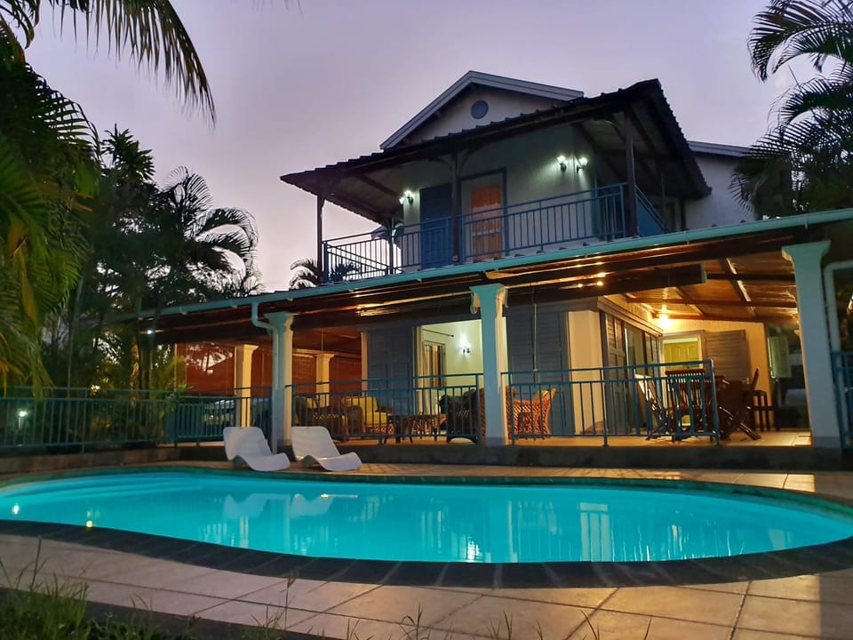 Property building, Patio, Pool view, Swimming pool, sunbed