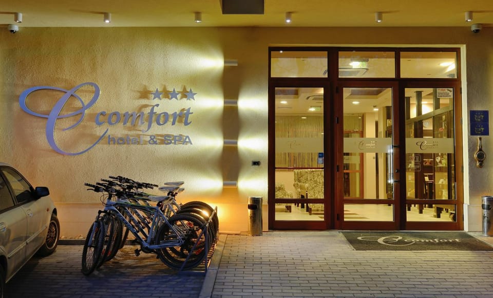 Facade/entrance, Property logo or sign, Cycling, Text overlay, Parking