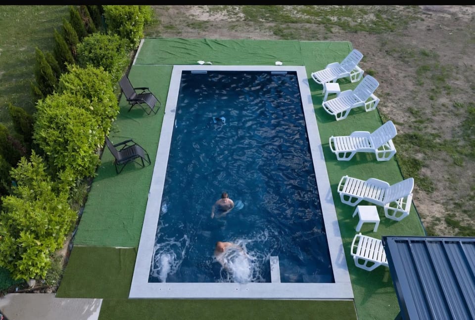 Day, Pool view, Swimming pool, group of guests, sunbed