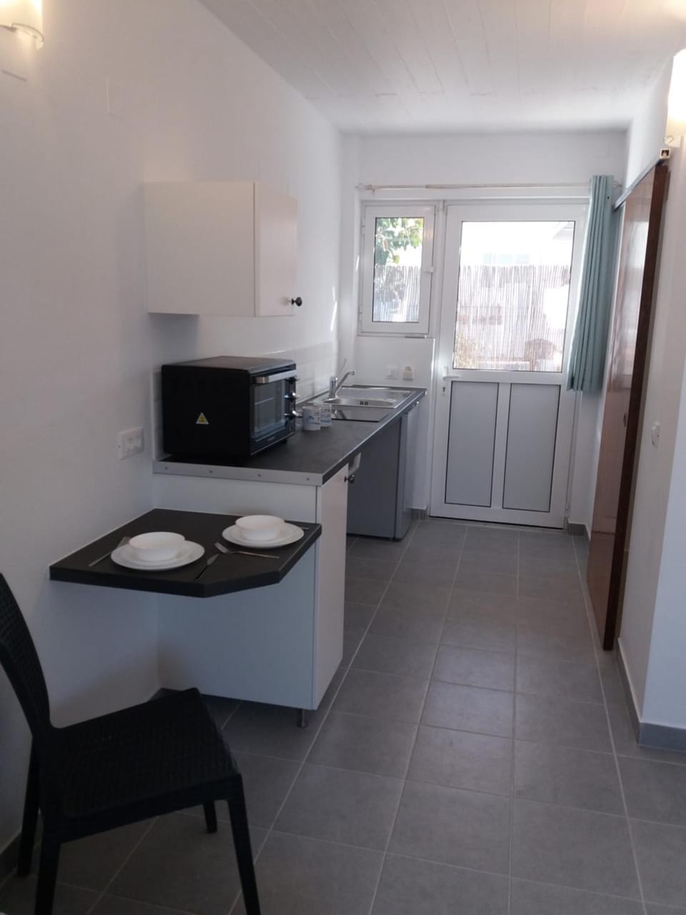 Coffee/tea facilities, Kitchen or kitchenette, Seating area, Dining area, Facility for disabled guests