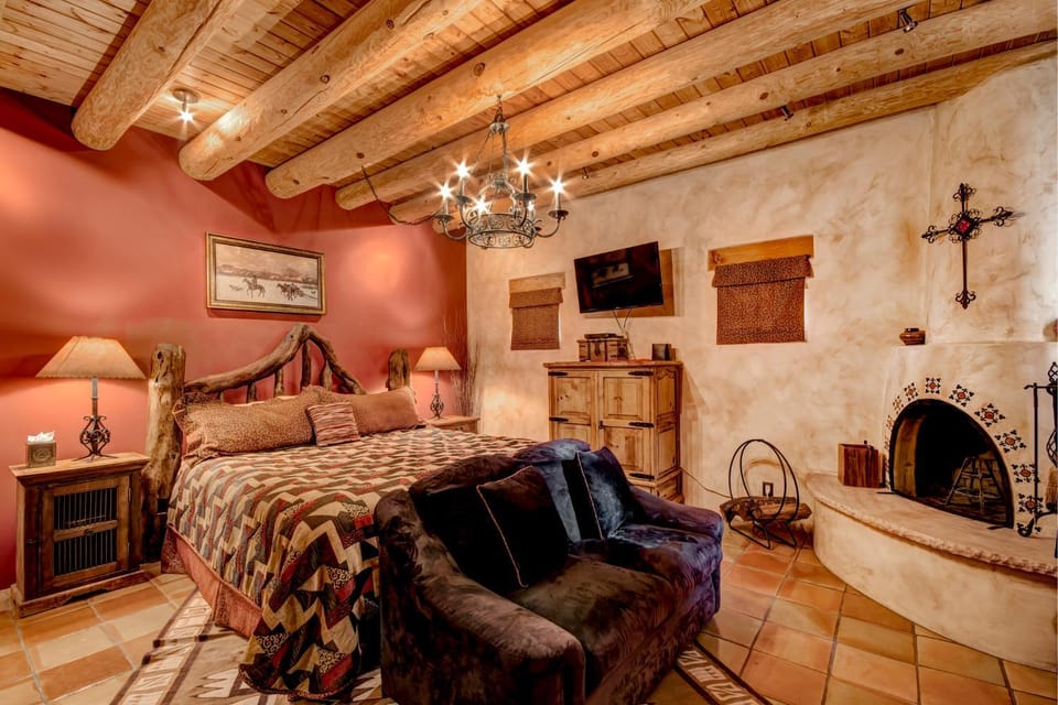 Bed, TV and multimedia, Living room, Seating area, Bedroom, fireplace, furniture