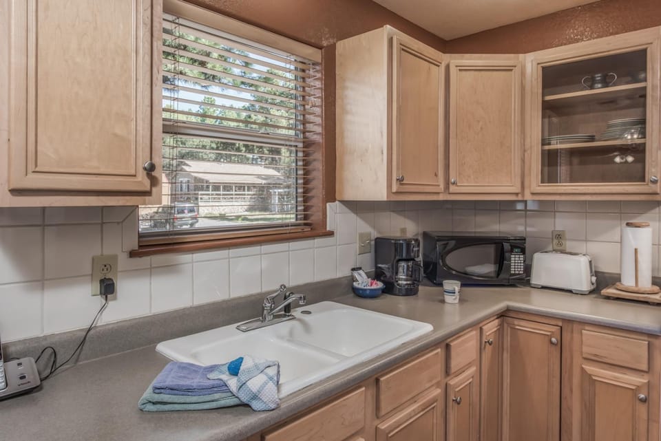 microwave, toaster, towels, kitchen