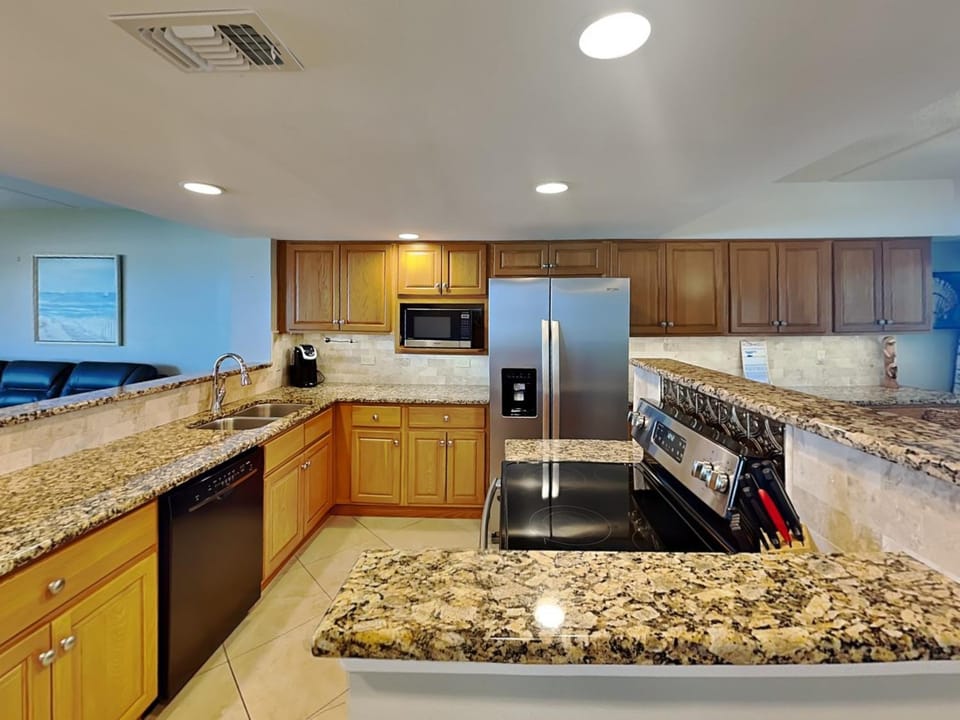 Kitchen or kitchenette, microwave, oven, stove, kitchen, air conditioner