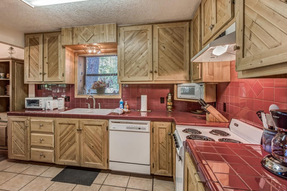 Kitchen or kitchenette, dishwasher, microwave, oven, stove, toaster