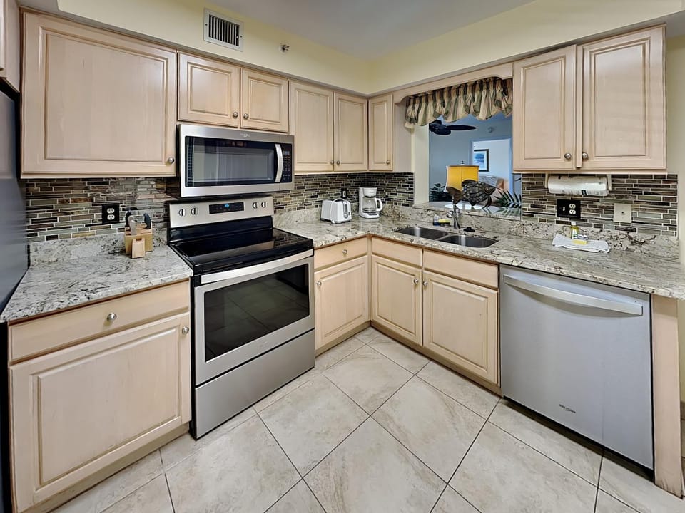 Kitchen or kitchenette, dishwasher, microwave, oven, stove, air conditioner