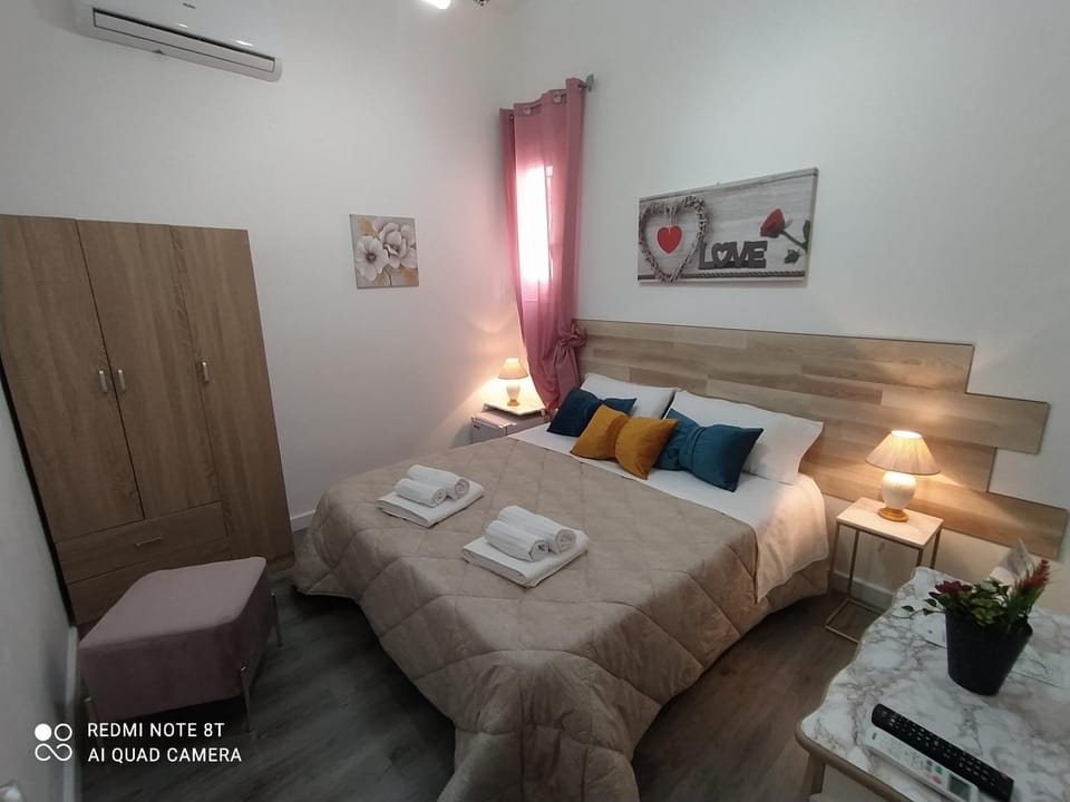 Bed, Photo of the whole room, Bedroom, towels, air conditioner