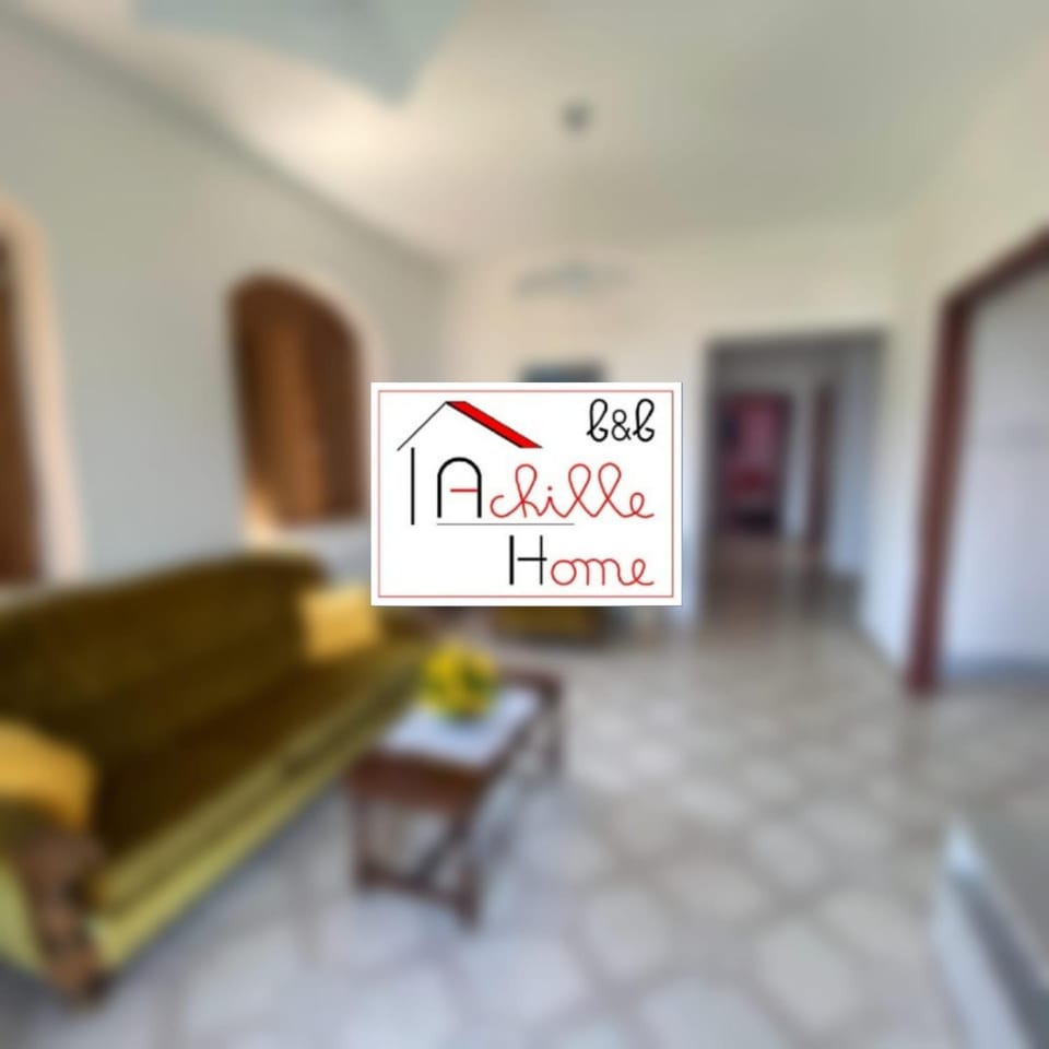 Property building, Living room, Seating area, Logo/Certificate/Sign, Text overlay