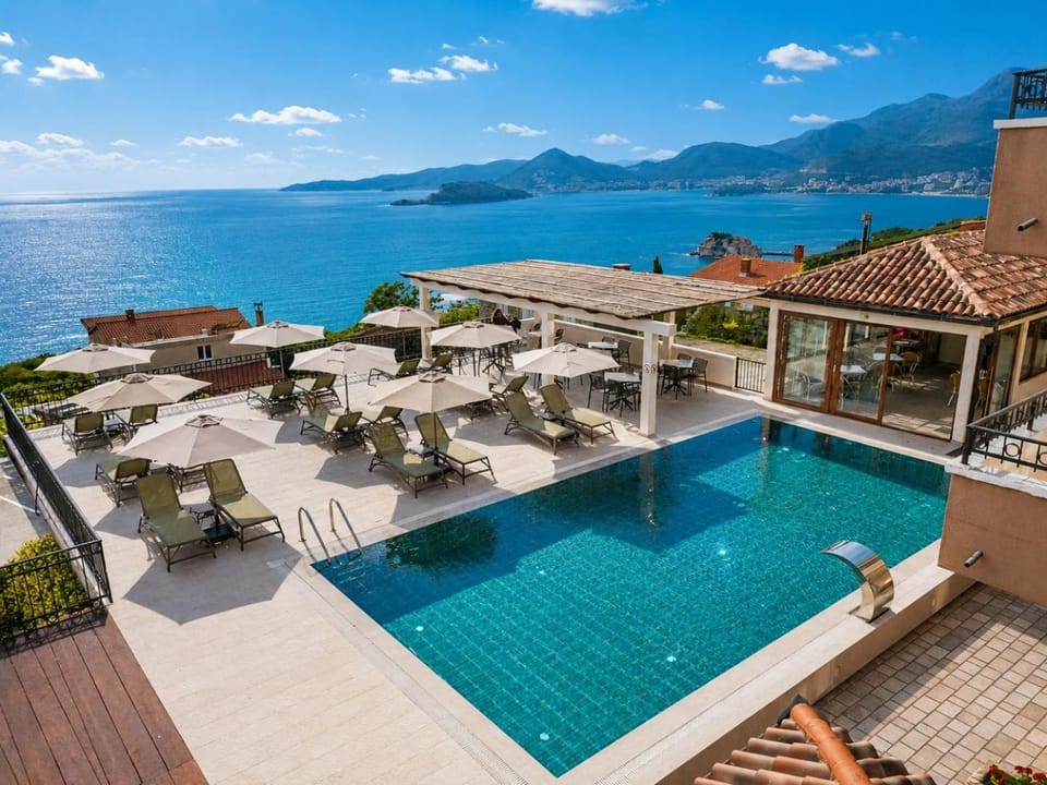 Property building, Patio, Day, Natural landscape, View (from property/room), Balcony/Terrace, Pool view, Sea view, Swimming pool, sunbed