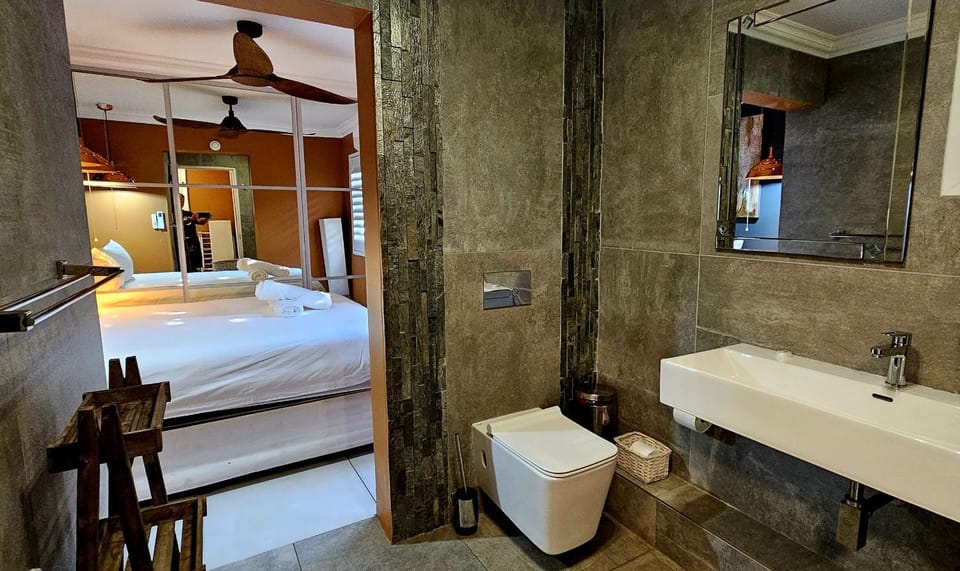 Shower, Toilet, Bed, Bathroom, Bedroom, hair dryier, towels, wardrobe, air conditioner