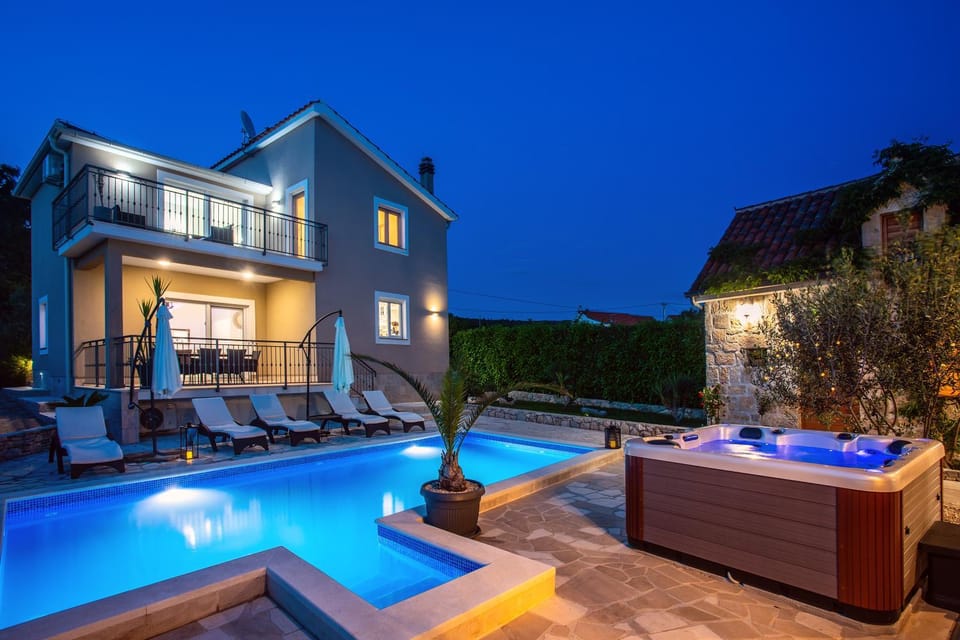 Property building, Patio, Night, Natural landscape, Pool view, Swimming pool