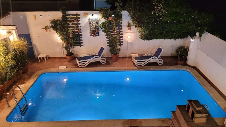 Patio, Night, Swimming pool, sunbed
