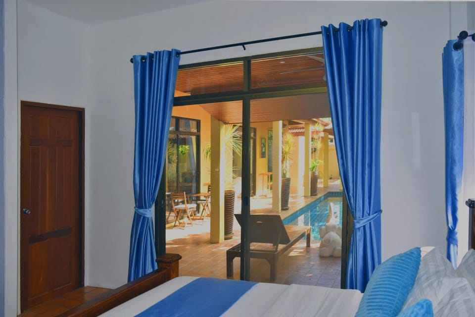Bed, Seating area, Bedroom, Pool view, Swimming pool, sunbed