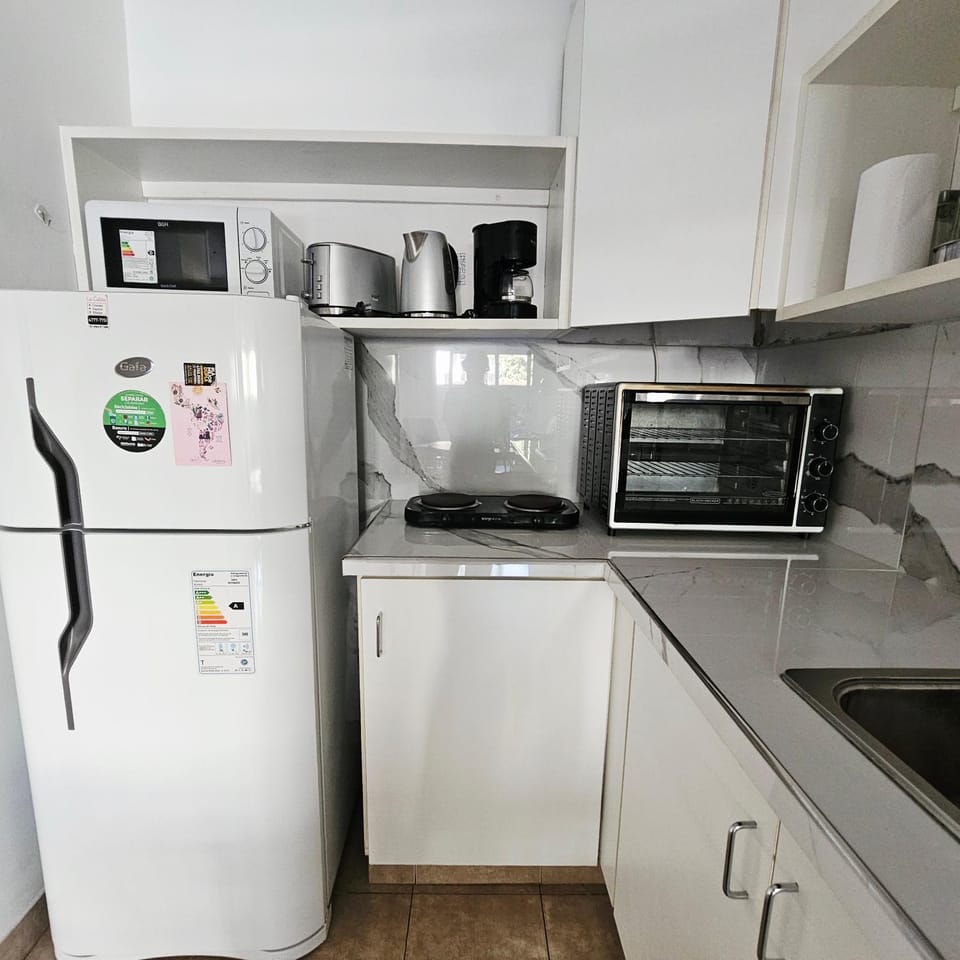 Kitchen or kitchenette, oven, stove, toaster