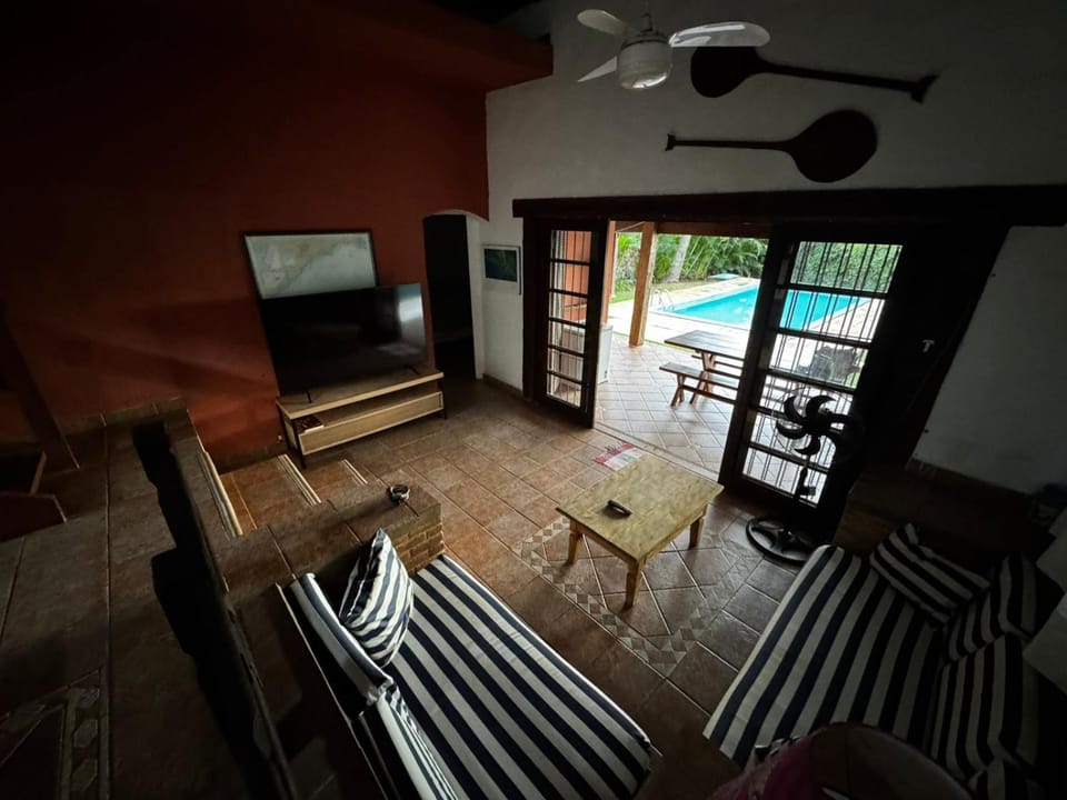 Communal lounge/ TV room, TV and multimedia, Living room, Seating area, Pool view