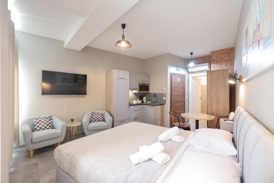 Bed, Kitchen or kitchenette, Seating area, towels