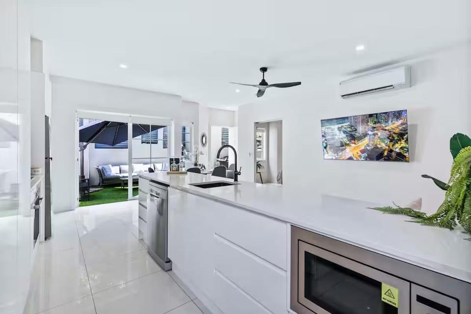 Kitchen or kitchenette, dishwasher, oven, stove, air conditioner