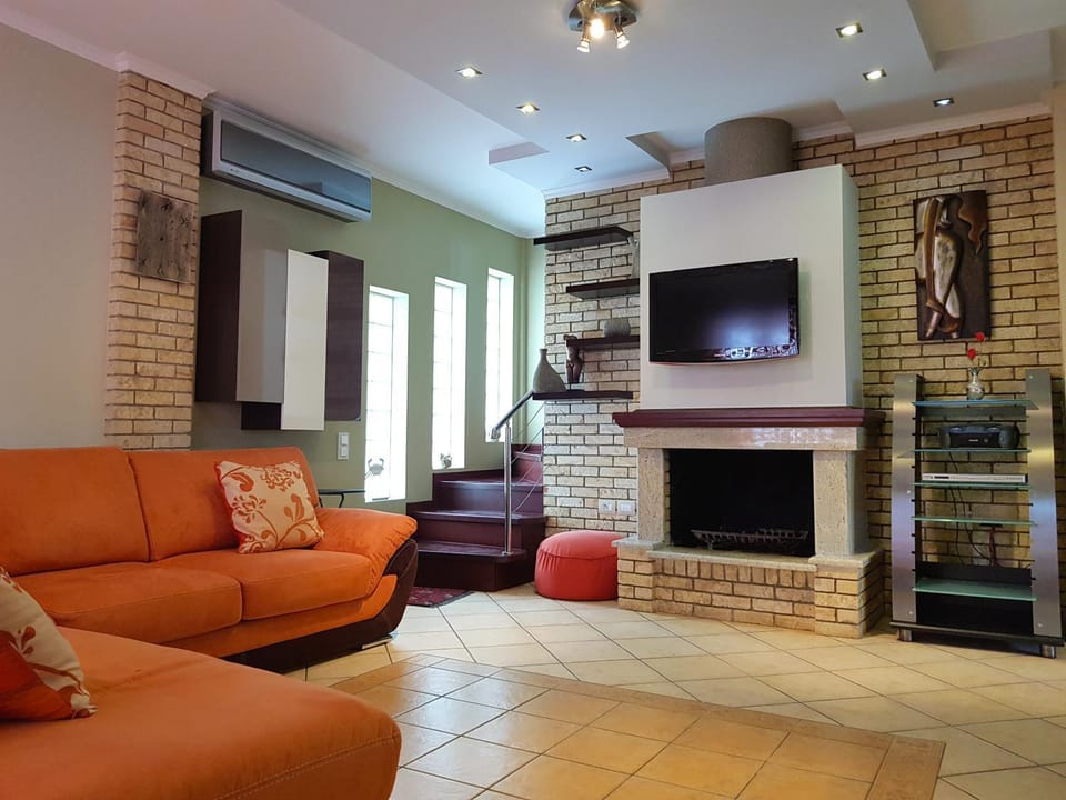 TV and multimedia, Living room, Seating area, flat iron, air conditioner