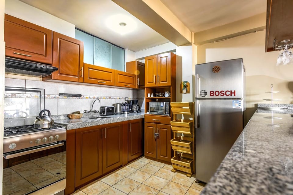 Kitchen or kitchenette, dishwasher, microwave, oven, toaster, kitchen