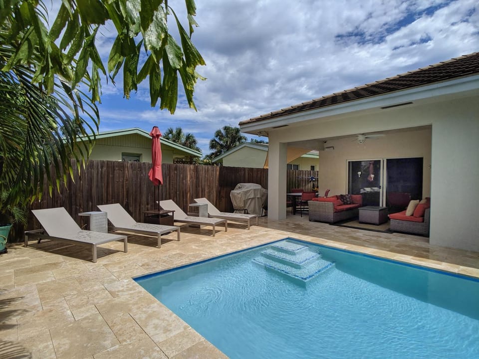 Property building, Patio, Seating area, Pool view, Swimming pool, sunbed