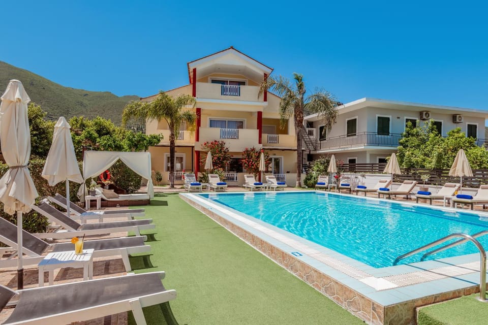 Property building, Day, Natural landscape, Pool view, Swimming pool, sunbed
