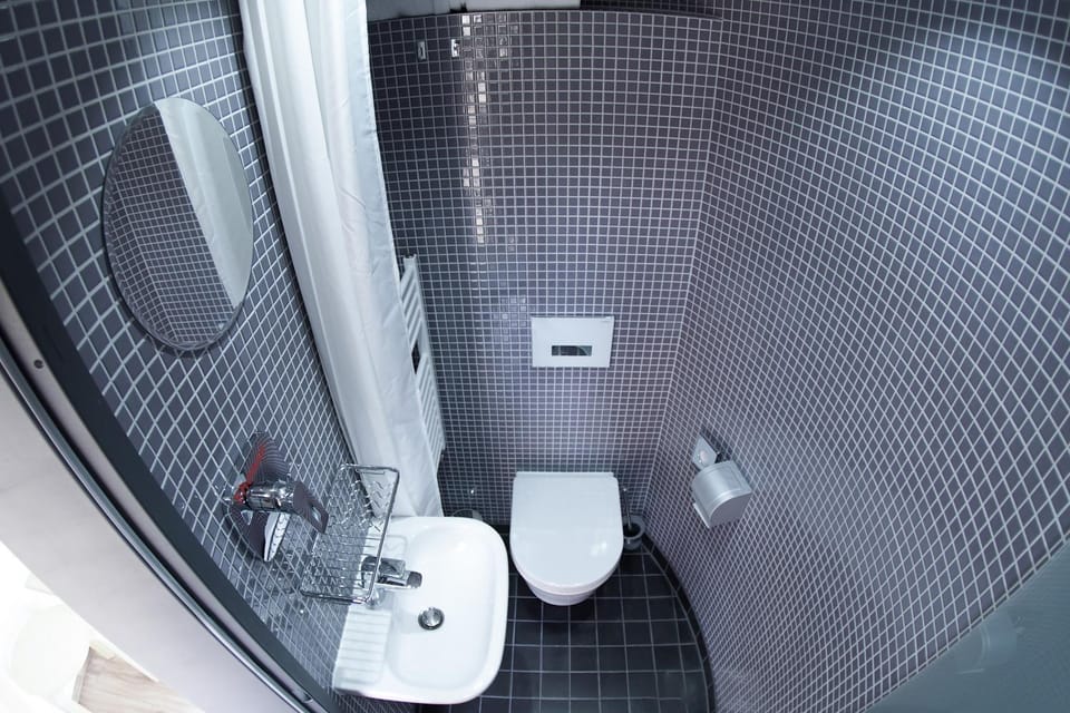 Shower, Toilet, Bathroom, hair dryier, towels