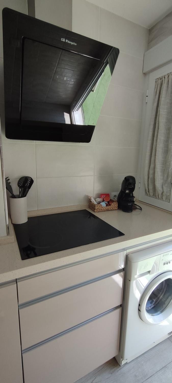 Kitchen or kitchenette, washing machine