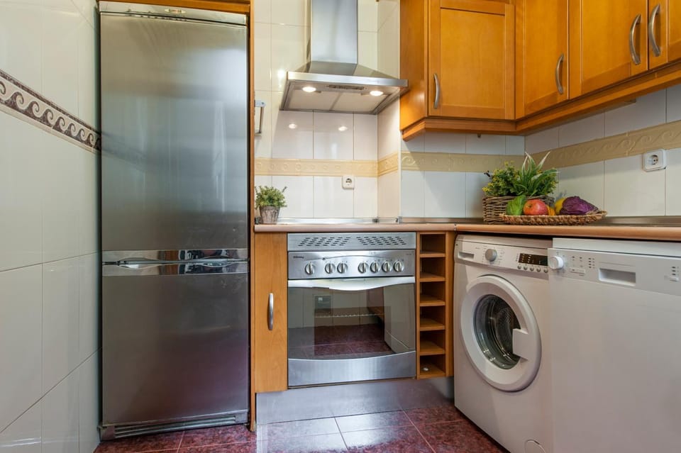 Kitchen or kitchenette, dishwasher, oven, stove, washing machine