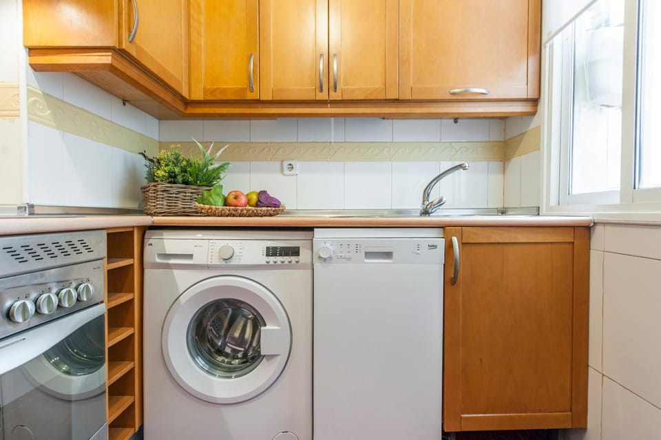 Kitchen or kitchenette, oven, stove, washing machine