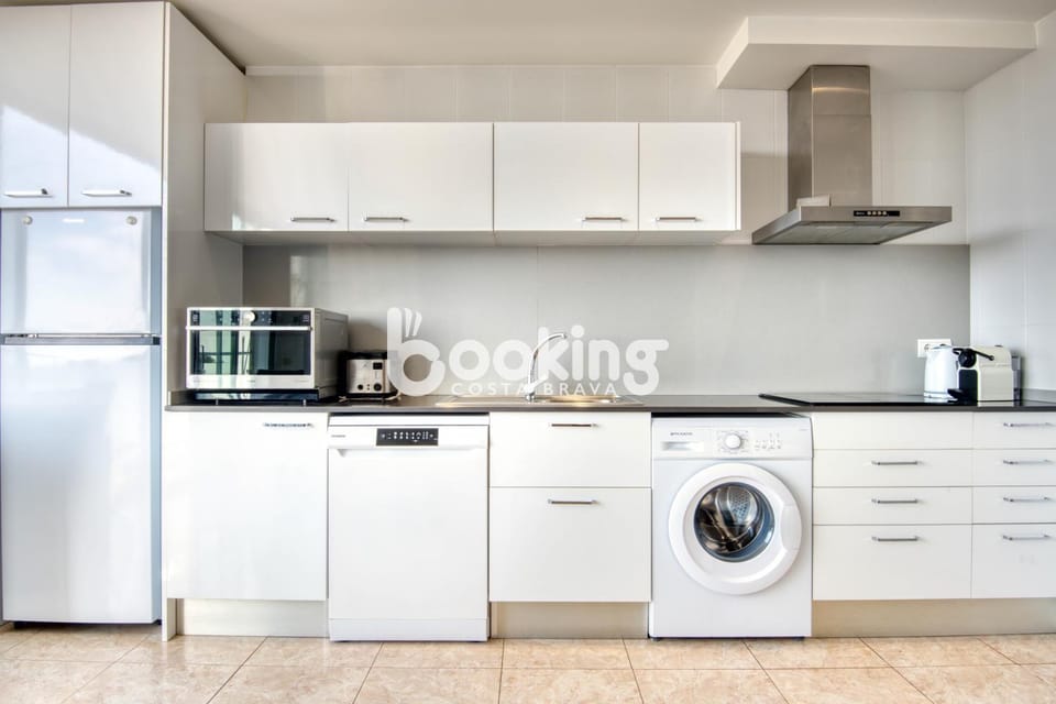 Kitchen or kitchenette, dishwasher, oven, stove, toaster, washing machine