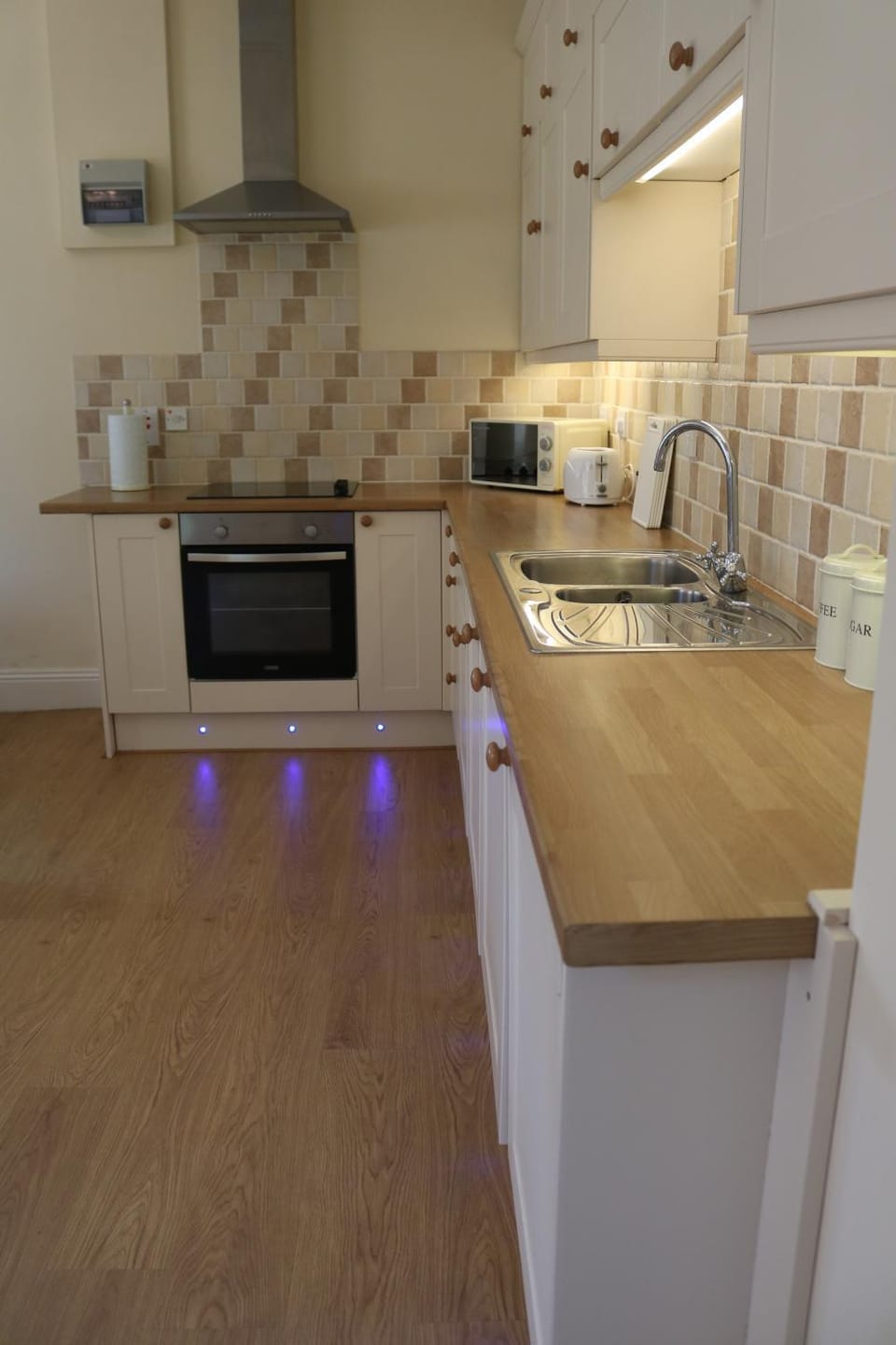 Kitchen or kitchenette, dishwasher, oven, stove, toaster
