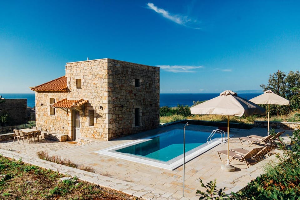 Property building, Patio, Day, Natural landscape, Sea view, Swimming pool