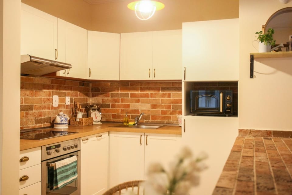 Kitchen or kitchenette, dishwasher, oven, stove